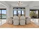 Bright dining area with modern furniture and a scenic lake view at 18601 Bluff Point Rd, Cornelius, NC 28031