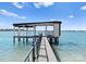 Picturesque dock extending into the water, offering stunning waterfront views and private access to the lake at 18601 Bluff Point Rd, Cornelius, NC 28031