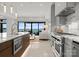 Gourmet kitchen with stainless steel appliances and stunning lake views at 18601 Bluff Point Rd, Cornelius, NC 28031