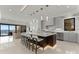 Modern kitchen with island seating, stylish lighting, and view of the lake at 18601 Bluff Point Rd, Cornelius, NC 28031
