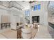 Elegant living room with high ceilings, modern decor, and a staircase at 18601 Bluff Point Rd, Cornelius, NC 28031