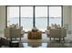 Contemporary living room featuring modern decor and stunning lake views at 18601 Bluff Point Rd, Cornelius, NC 28031