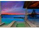 Inviting spa and pool with stunning waterfront views and a cozy lounge area at 18601 Bluff Point Rd, Cornelius, NC 28031