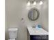 Powder room with decorative mirror, modern fixtures and a clean, minimalist design at 2006 Durand Rd, Fort Mill, SC 29715
