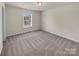 Cozy bedroom features carpet, natural light, and neutral paint scheme at 2006 Durand Rd, Fort Mill, SC 29715