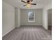 Comfortable bedroom features ceiling fan, closet, carpet, and a window at 2006 Durand Rd, Fort Mill, SC 29715
