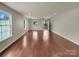 Spacious living room with hardwood floors and natural light from large windows at 2006 Durand Rd, Fort Mill, SC 29715