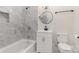 Well-lit bathroom featuring a shower-tub combo and modern vanity at 211 W 6Th Ave, Gastonia, NC 28052