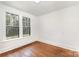 Bright bedroom with hardwood floors and large windows providing ample natural light at 211 W 6Th Ave, Gastonia, NC 28052