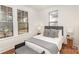Cozy bedroom filled with natural light featuring warm hardwood floors at 211 W 6Th Ave, Gastonia, NC 28052