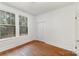 Bedroom featuring hardwood floors, closet, and windows for natural light at 211 W 6Th Ave, Gastonia, NC 28052