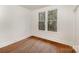 Bedroom featuring hardwood floors and windows for natural light at 211 W 6Th Ave, Gastonia, NC 28052