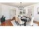 Dining room with hardwood floors, modern lighting, and an open floor plan at 211 W 6Th Ave, Gastonia, NC 28052