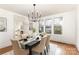 Elegant dining room featuring modern chandelier and ample natural light at 211 W 6Th Ave, Gastonia, NC 28052