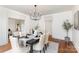 Formal dining room with hardwood floors, neutral walls, and stylish accents at 211 W 6Th Ave, Gastonia, NC 28052