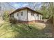 Exterior view of a well-maintained home with a brick foundation and lawn at 211 W 6Th Ave, Gastonia, NC 28052