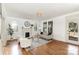 Bright living room boasts hardwood floors, fireplace, and neutral decor at 211 W 6Th Ave, Gastonia, NC 28052
