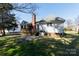A backyard showcasing a deck, patio, and well-maintained lawn, ideal for outdoor entertaining at 2129 Belle Chase Dr, Rock Hill, SC 29732