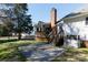 Multi-level backyard deck with stairs and lattice details, adjacent to a brick chimney and patio space at 2129 Belle Chase Dr, Rock Hill, SC 29732