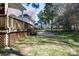 Backyard deck with access to yard and views of surrounding greenery and a wooden fence at 2129 Belle Chase Dr, Rock Hill, SC 29732