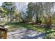 Expansive backyard featuring a concrete patio and lush greenery, creating a private and inviting outdoor space at 2129 Belle Chase Dr, Rock Hill, SC 29732