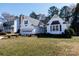 Inviting home with an attached garage, lush front lawn, and mature trees in a Gathering-friendly neighborhood at 2129 Belle Chase Dr, Rock Hill, SC 29732
