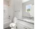 Bathroom with white tile, showerhead, bathtub, and vanity at 213 Shannonhouse W St, Shelby, NC 28152