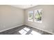 Bright bedroom featuring hardwood floors and two large windows at 213 Shannonhouse W St, Shelby, NC 28152