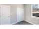 This bedroom boasts a closet and a window with natural light, offering a cozy retreat at 213 Shannonhouse W St, Shelby, NC 28152