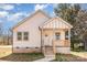 Charming exterior of home with light siding, covered porch, and well-maintained walkway at 213 Shannonhouse W St, Shelby, NC 28152