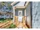 Charming front porch with steps and a light blue siding, welcoming you home at 213 Shannonhouse W St, Shelby, NC 28152
