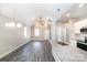 Open-concept living space with island, vaulted ceiling, and modern finishes at 213 Shannonhouse W St, Shelby, NC 28152