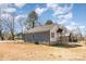 View of the home showing the backyard, light siding, and the foundation at 213 Shannonhouse W St, Shelby, NC 28152