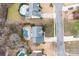 Aerial view showcases a home with a private pool, patio area, and lush landscaping at 215 Whitegrove Dr, Fort Mill, SC 29715