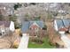 Aerial shot of a home with a well-maintained yard and mature trees in a quiet neighborhood at 215 Whitegrove Dr, Fort Mill, SC 29715
