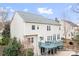 Back exterior of home, showing a large deck, patio area, and well-maintained landscaping at 215 Whitegrove Dr, Fort Mill, SC 29715