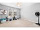 Bedroom featuring neutral walls, a ceiling fan, natural light, and workout equipment at 215 Whitegrove Dr, Fort Mill, SC 29715