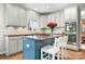 Island featuring seating, cooktop and stainless appliances in the kitchen with granite counters and tile backsplash at 215 Whitegrove Dr, Fort Mill, SC 29715