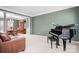 Formal living room showcasing a piano and adjoins a formal dining room at 215 Whitegrove Dr, Fort Mill, SC 29715