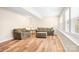 Finished basement featuring laminate wood flooring, two couches, and natural light at 215 Whitegrove Dr, Fort Mill, SC 29715