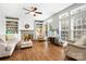 Spacious living room featuring a fireplace, built-in shelving, hardwood floors, and comfortable seating at 215 Whitegrove Dr, Fort Mill, SC 29715