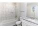 Bathroom featuring a granite-look vanity top and tiled tub at 220 Shannonhouse W St, Shelby, NC 28152