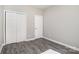 Bedroom featuring double door closet plus sleek gray flooring at 220 Shannonhouse W St, Shelby, NC 28152