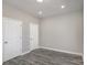 Neutral bedroom with gray wood floors, two closets, and modern recessed lighting at 220 Shannonhouse W St, Shelby, NC 28152