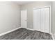 Bedroom showcasing a double closet and sleek flooring at 220 Shannonhouse W St, Shelby, NC 28152
