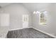 Bright dining area featuring modern chandelier lighting at 220 Shannonhouse W St, Shelby, NC 28152