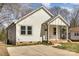 Charming home featuring white siding and a well-maintained front lawn at 220 Shannonhouse W St, Shelby, NC 28152