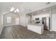 Modern kitchen featuring white cabinets, granite countertops, and stainless steel appliances at 220 Shannonhouse W St, Shelby, NC 28152
