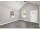 Bright living room with vaulted ceilings and luxury vinyl plank flooring at 220 Shannonhouse W St, Shelby, NC 28152