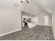 Open-concept kitchen and living area with modern appliances and LVP flooring at 220 Shannonhouse W St, Shelby, NC 28152